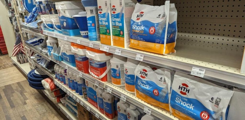 Pool chemicals in an aisle of a pool store