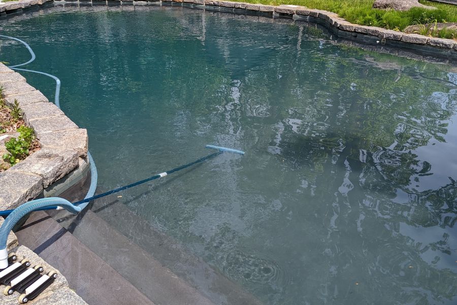 Brushing the pool during opening